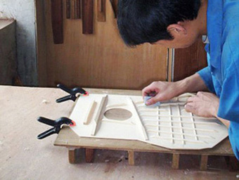 Hand Polishing the Braces for Better Sound.